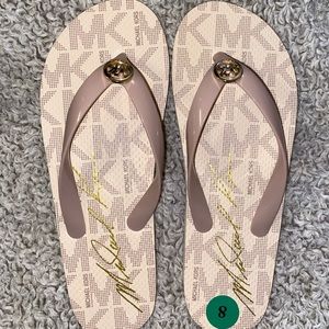 Brand new Michael Kors flip flops.